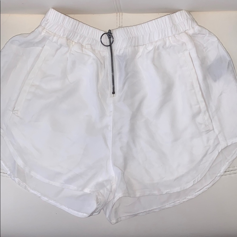 LF white flowy shorts.